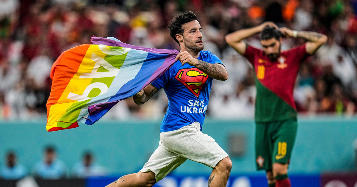 Protester with rainbow flag runs onto field at World Cup